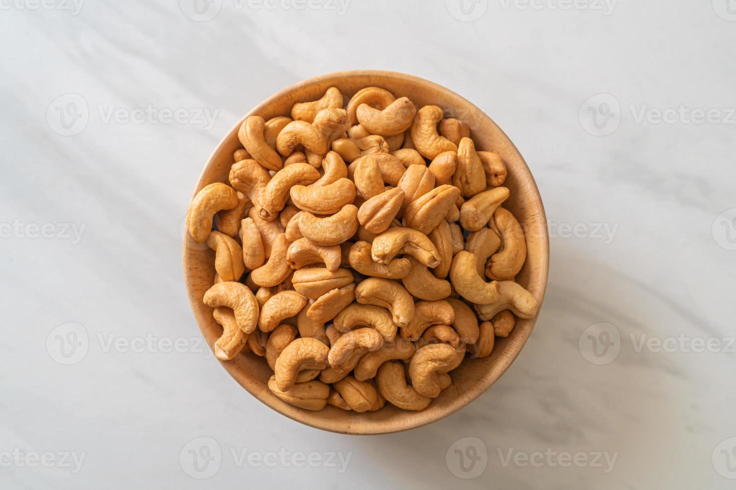 Cashew nuts in wooden bowl photo