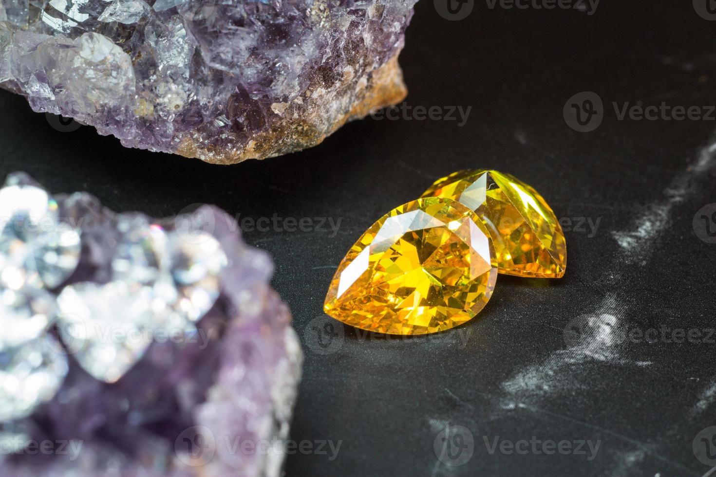 Natural yellow Sapphire gemstone, beautiful yellow gold citrin gemstone isolated on black background, as jewelry background photo