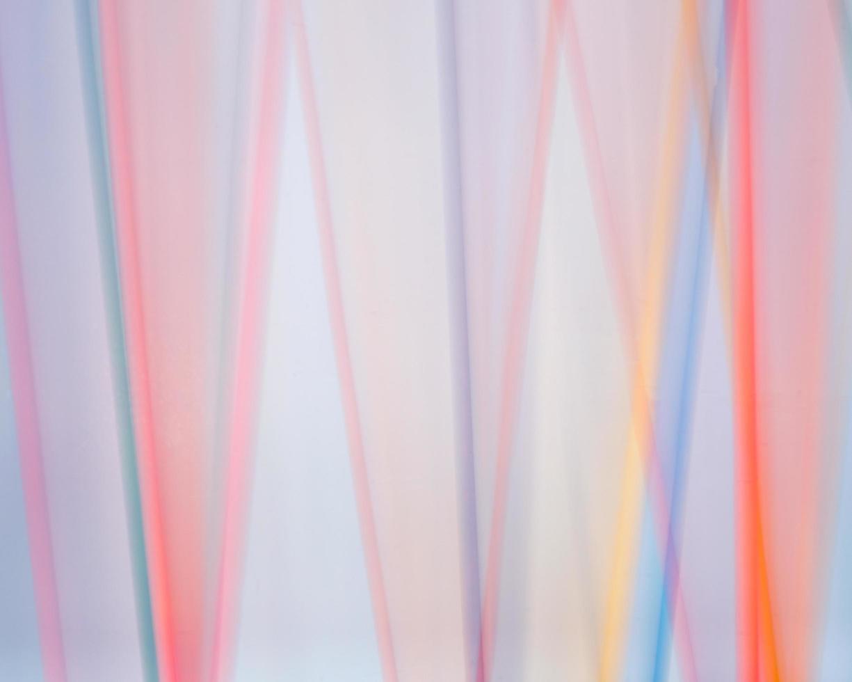 Colored Dowels Blurred Against White photo