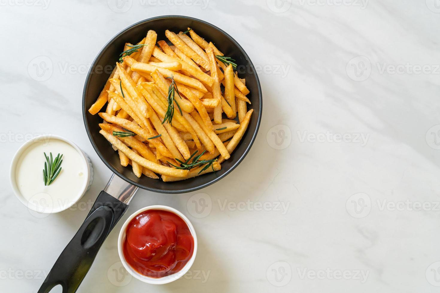 French fries with sour cream and ketchup photo