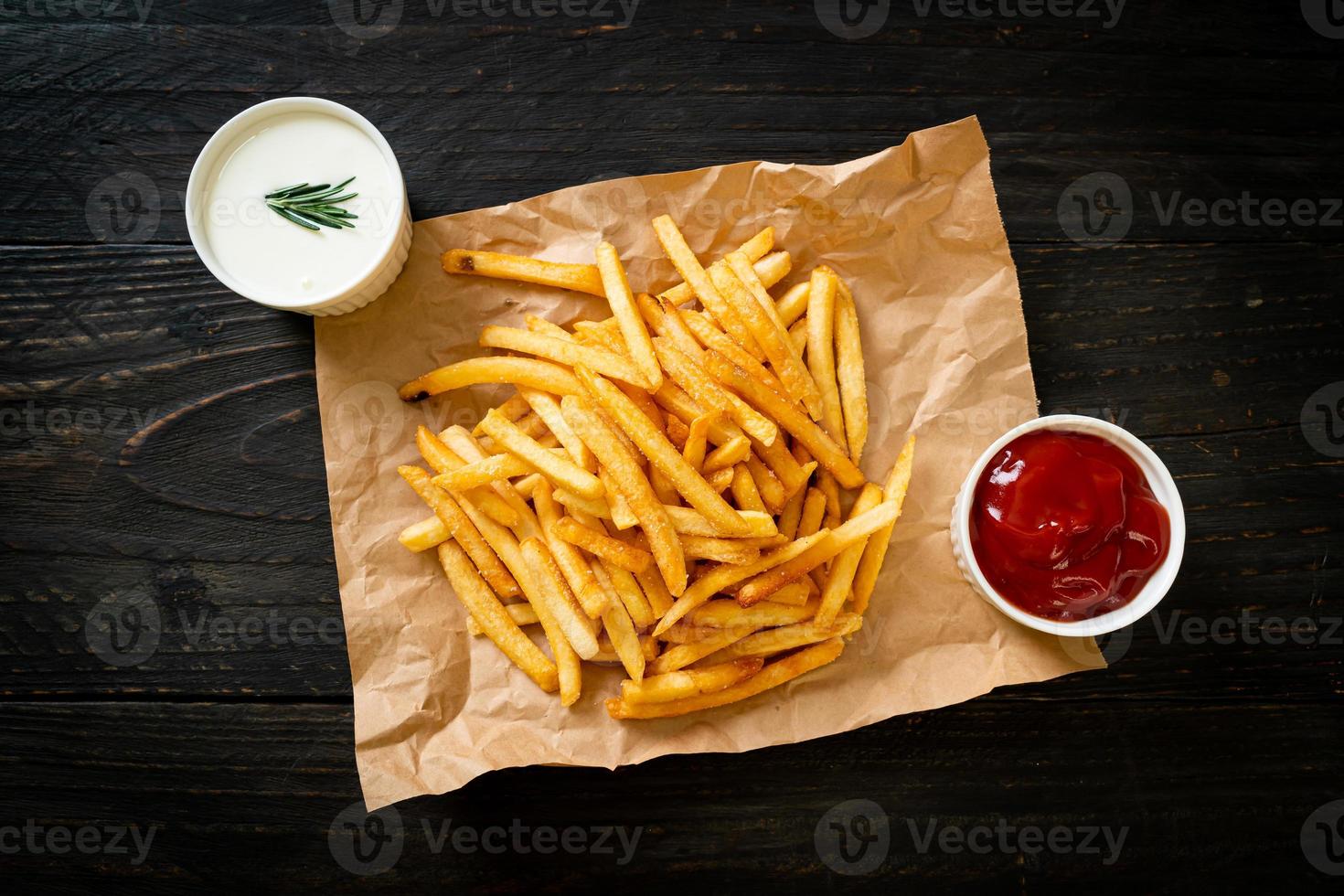 French fries with sour cream and ketchup photo