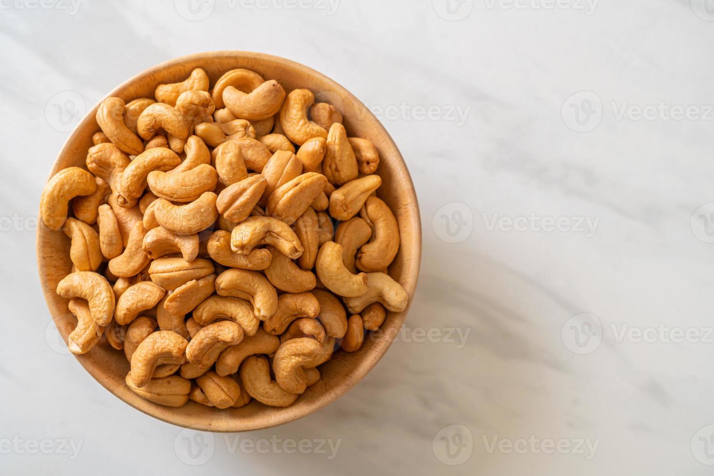 Cashew nuts in wooden bowl photo