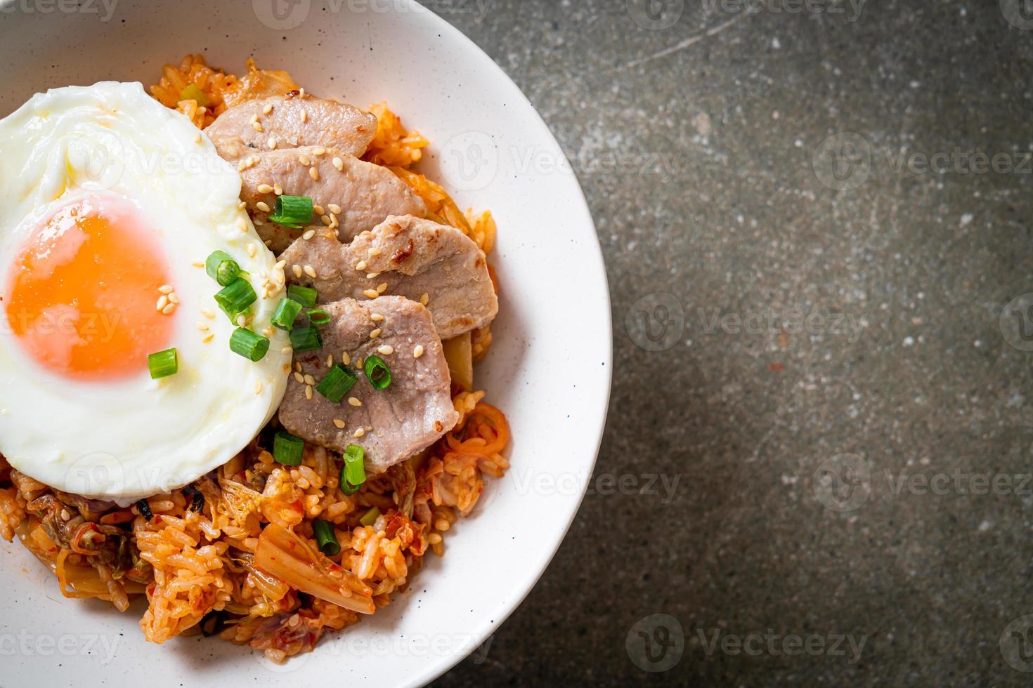 Kimchi fried rice with fried egg and pork photo