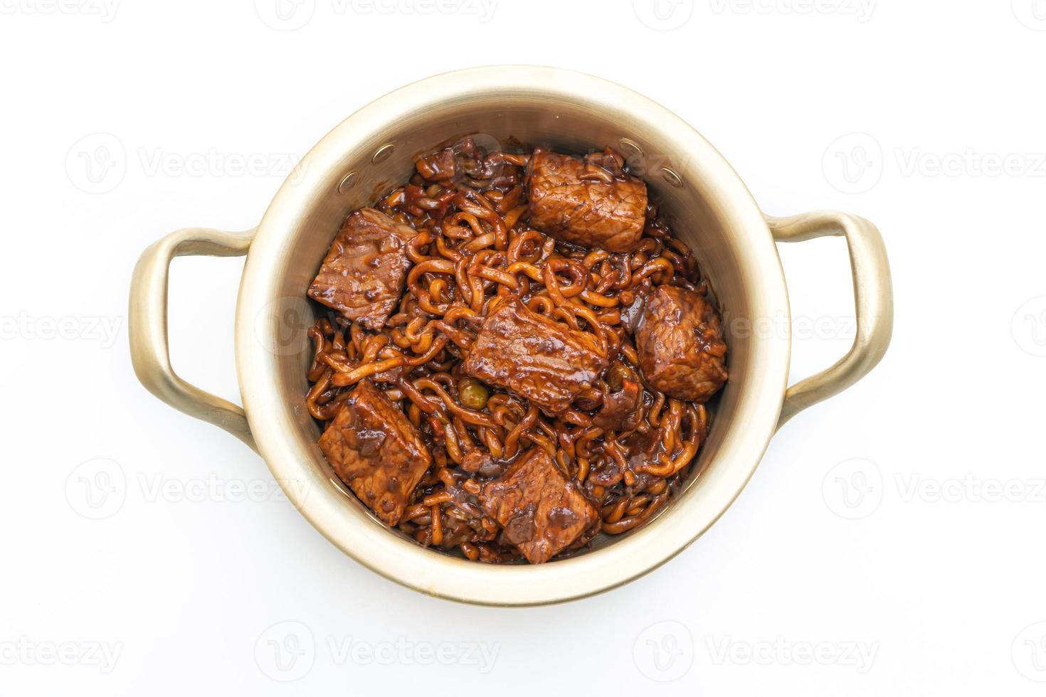 Jjapaguri or Chapaguri, Korean Black Beans Spicy Noodles with Beef on white background photo