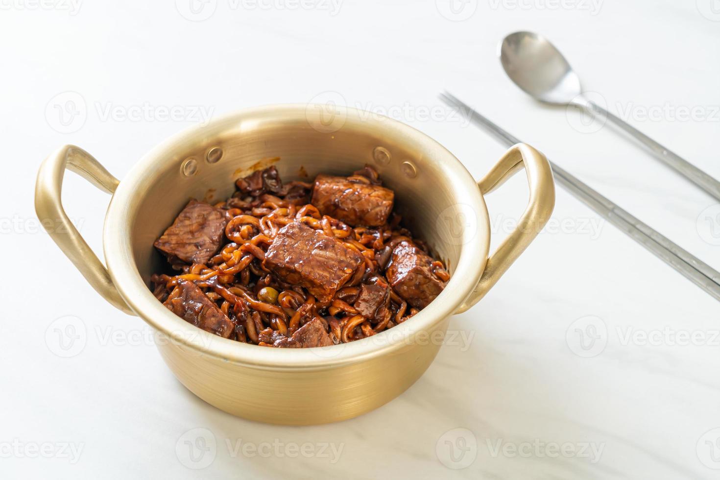 Jjapaguri or Chapaguri, Korean Black Beans Spicy Noodles with Beef photo