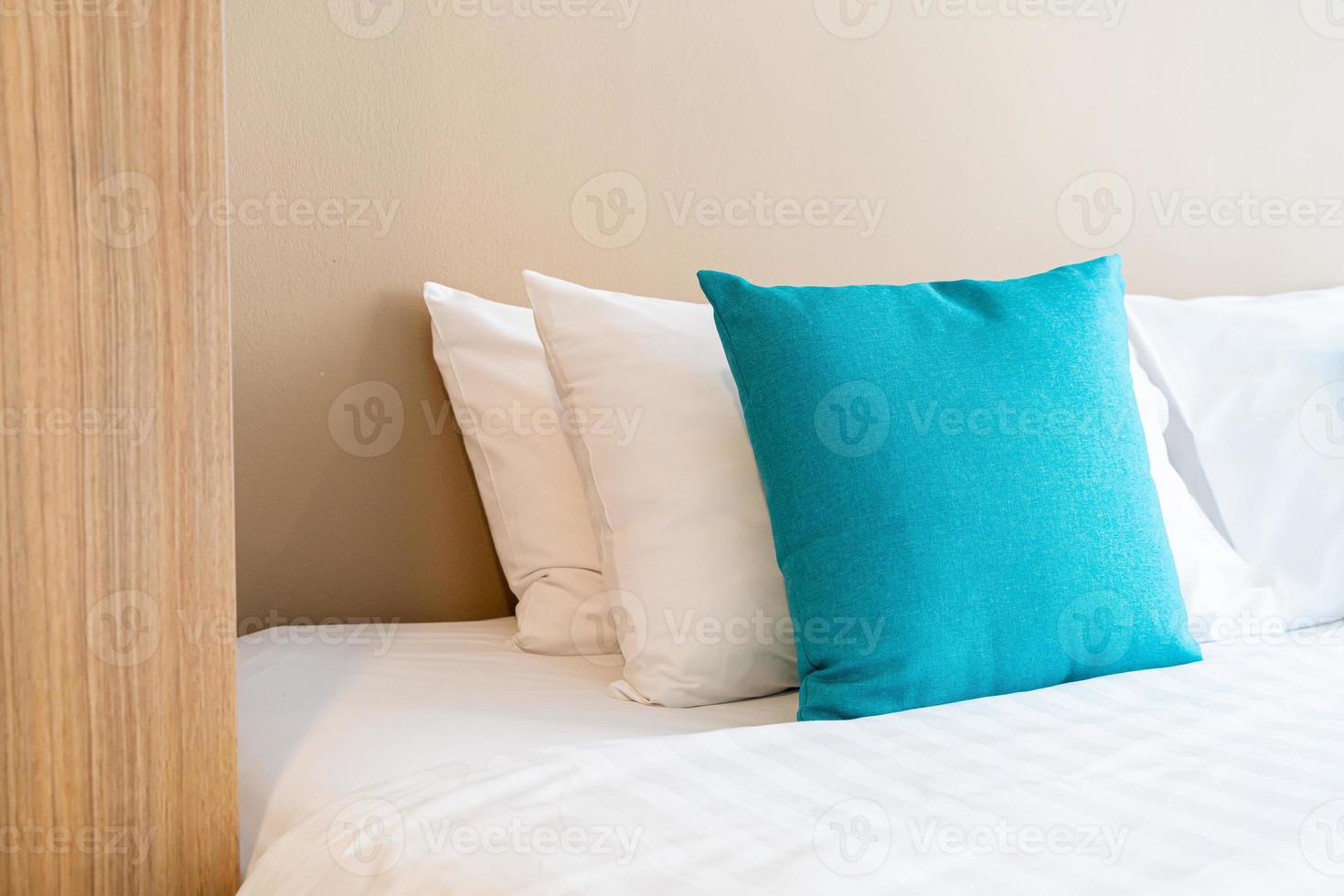 Beautiful and comfortable pillows decoration on bed in bedroom photo