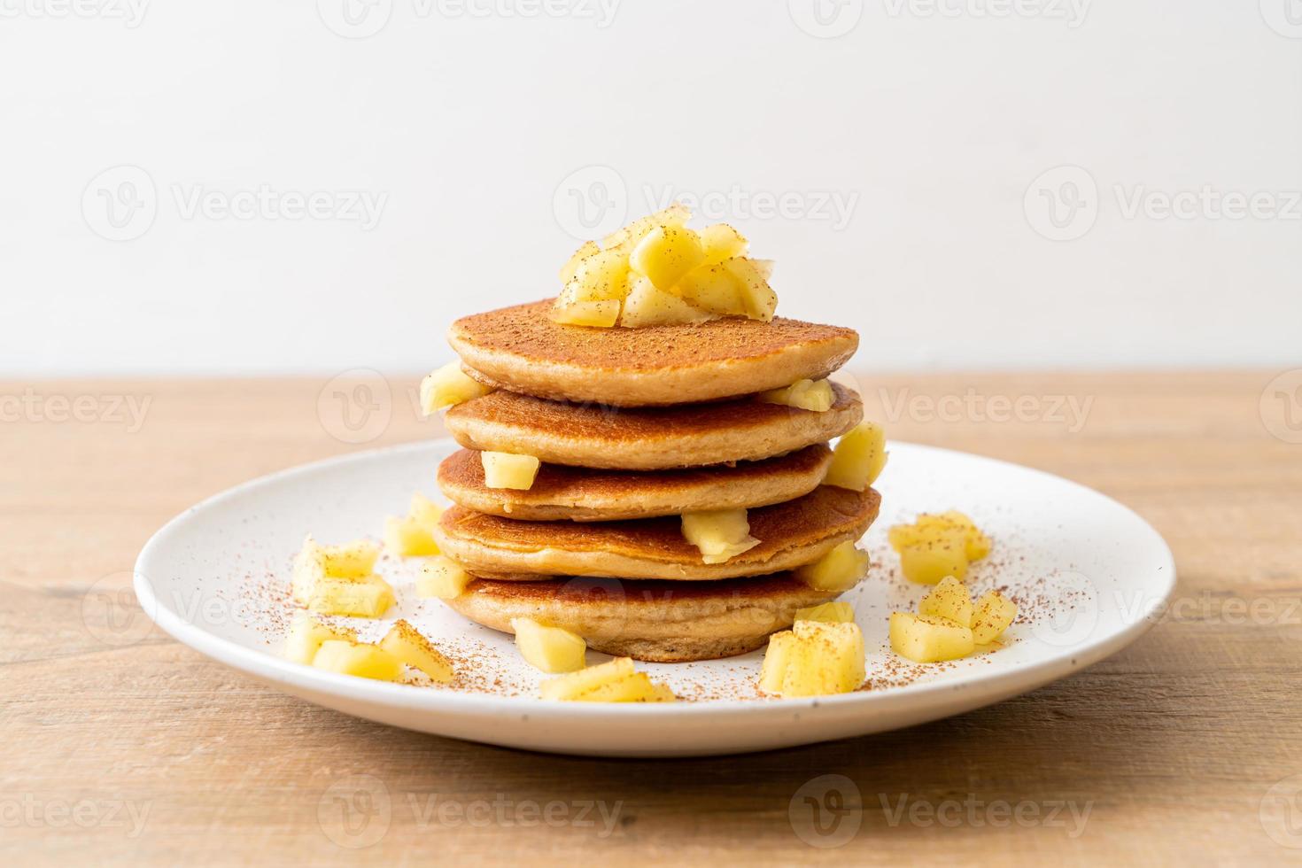 Apple pancake or apple crepe with cinnamon powder photo