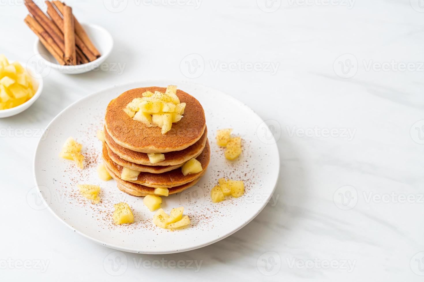 Apple pancake or apple crepe with cinnamon powder photo