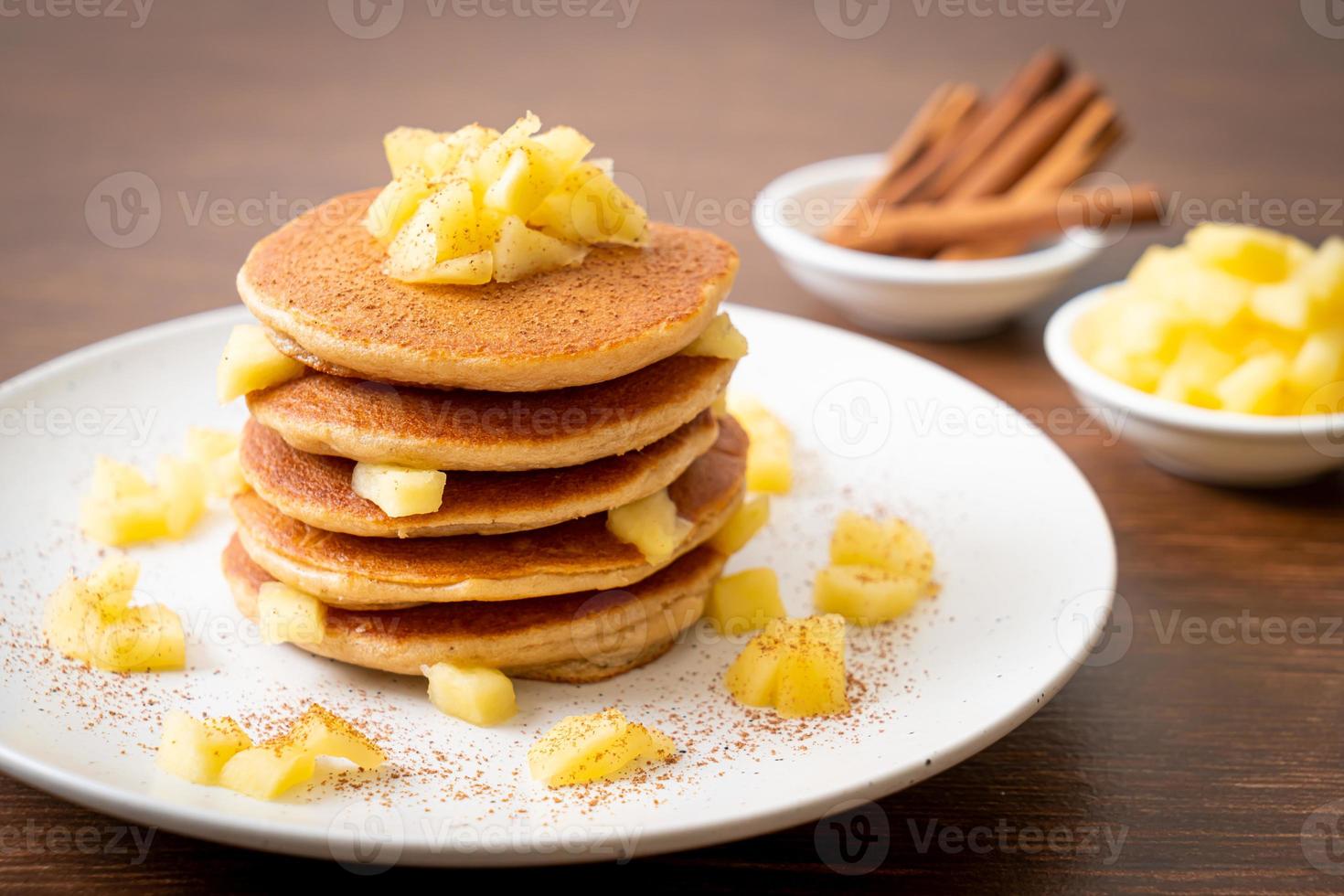 Apple pancake or apple crepe with cinnamon powder photo