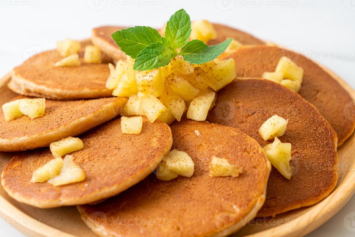 Apple pancake or apple crepe with cinnamon powder photo