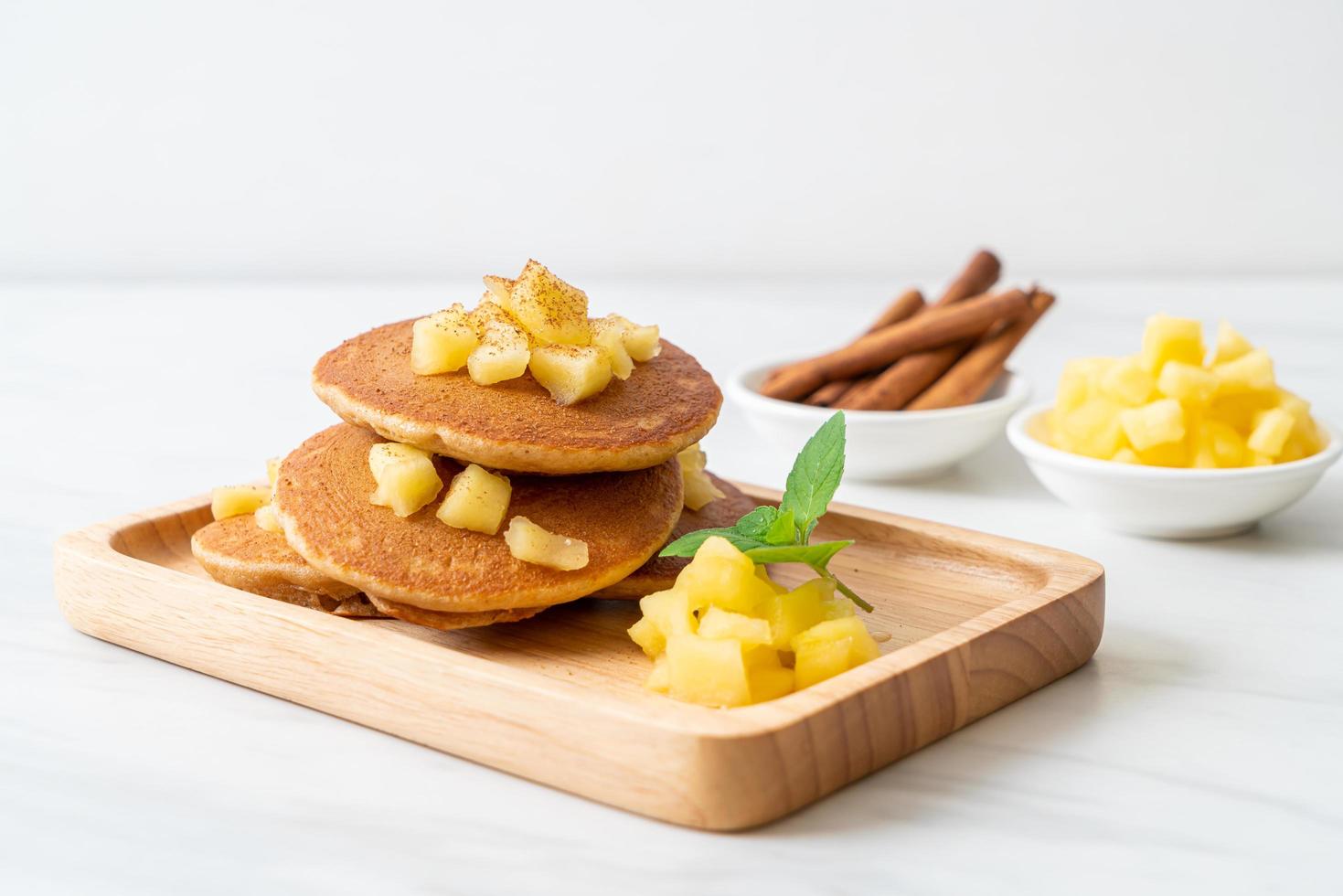 Apple pancake or apple crepe with cinnamon powder photo