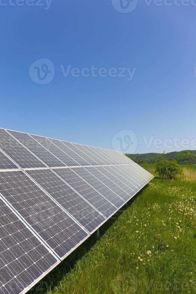 Solar Power Station on the summer flowering Meadow photo