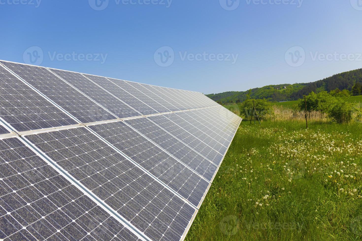 Solar Power Station on the summer flowering Meadow photo