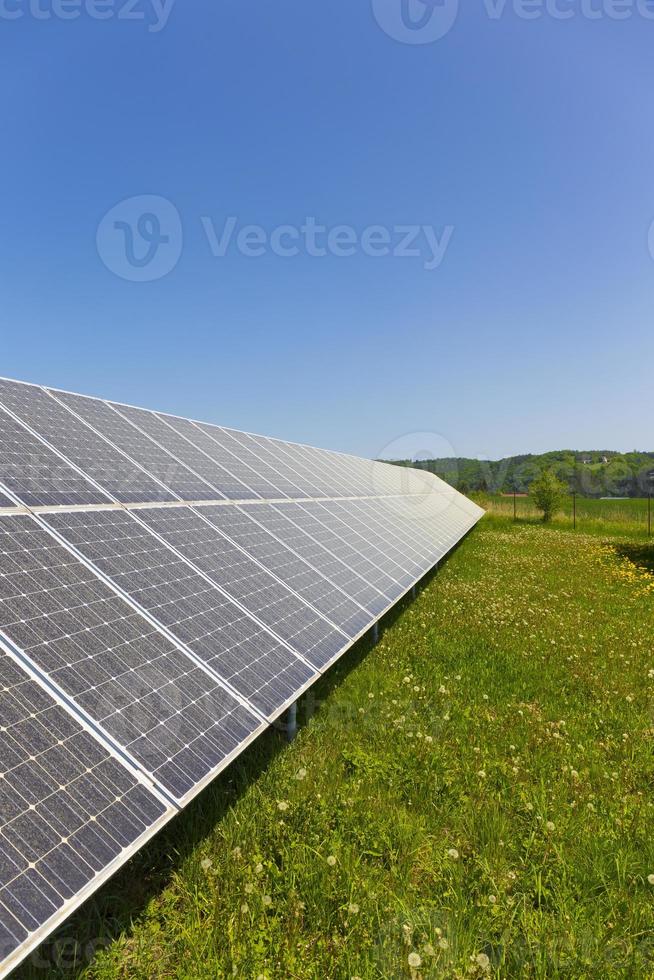 Solar Power Station on the summer flowering Meadow photo