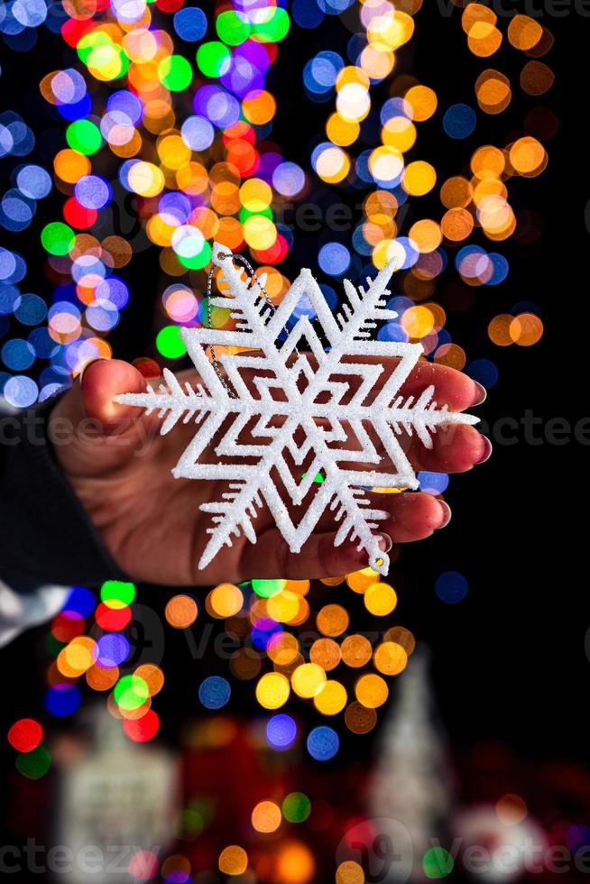 Hand holding Christmas decoration photo