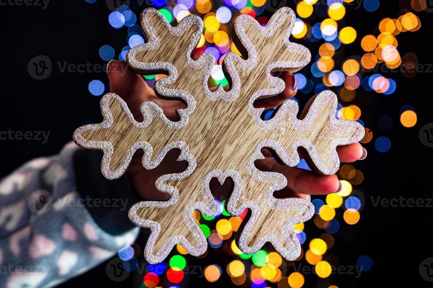 Hand holding Christmas decoration photo