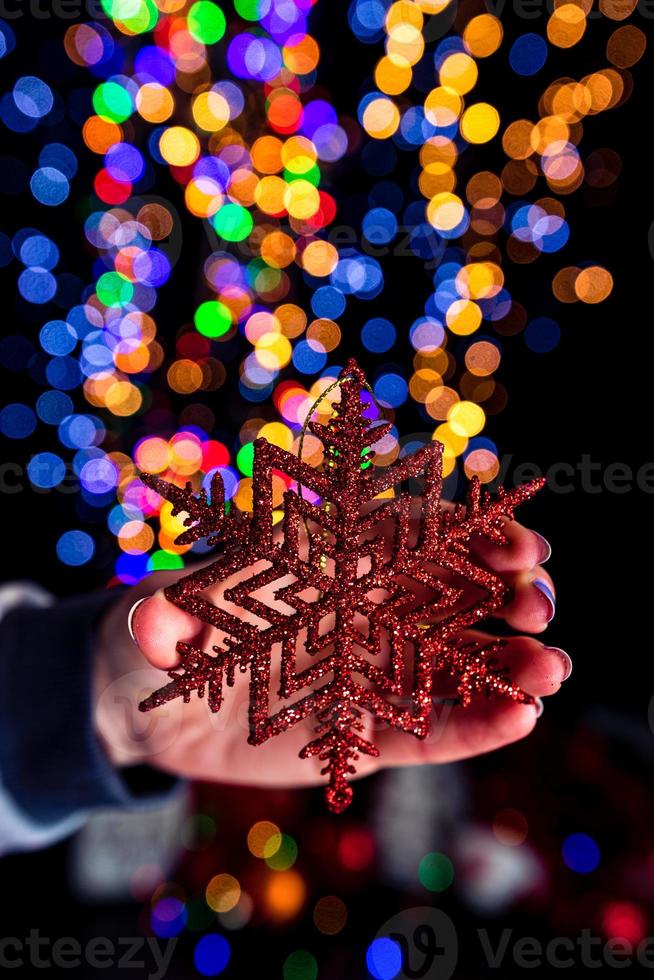 Hand holding Christmas decoration photo