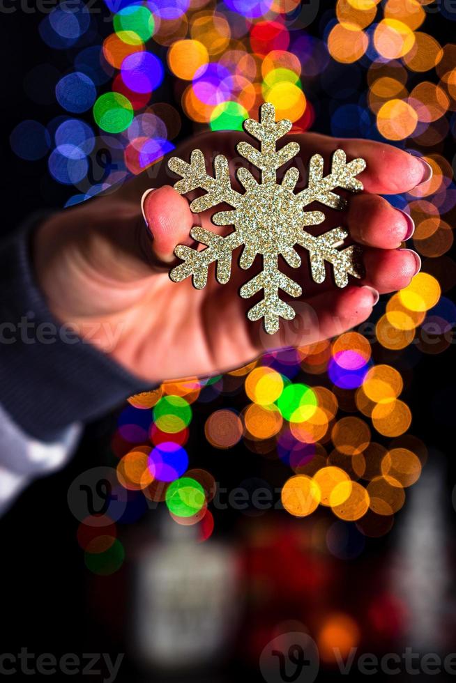 Hand holding Christmas decoration photo
