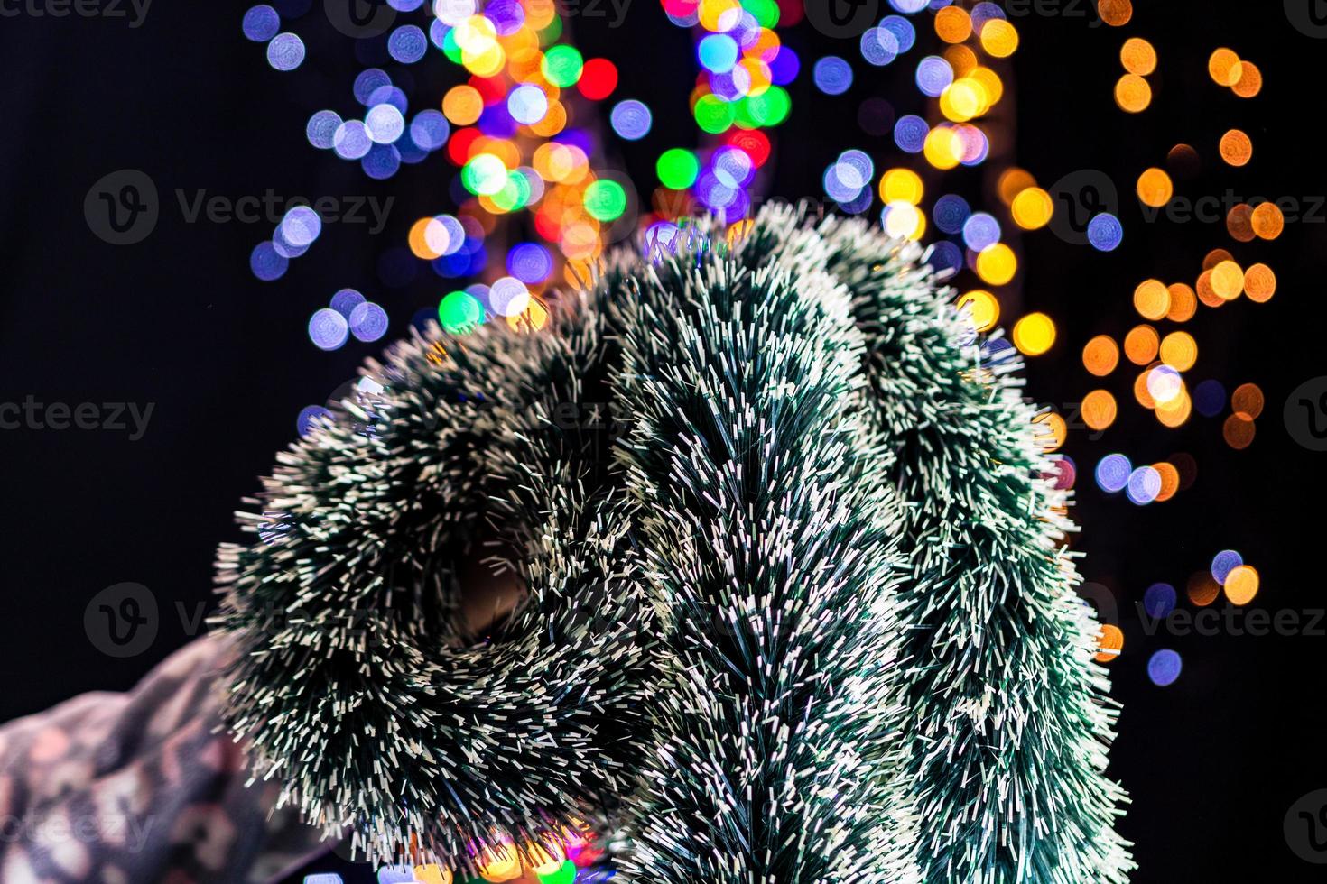 Hand holding Christmas decoration photo