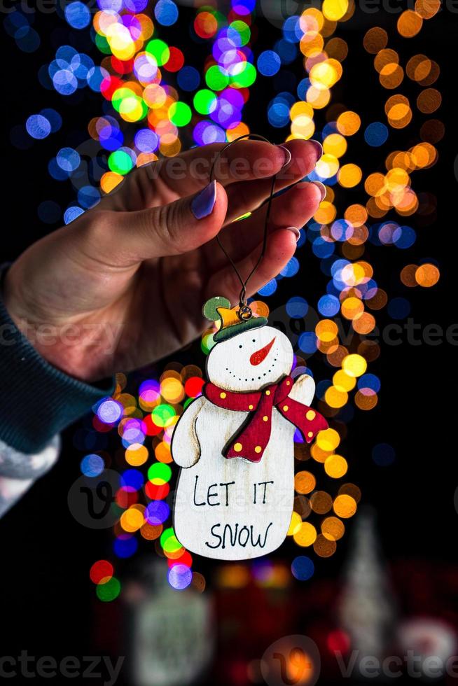 Hand holding Christmas decoration photo