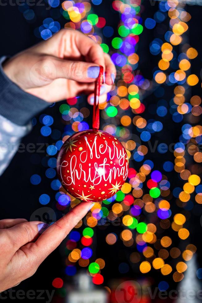 Hand holding Christmas decoration photo