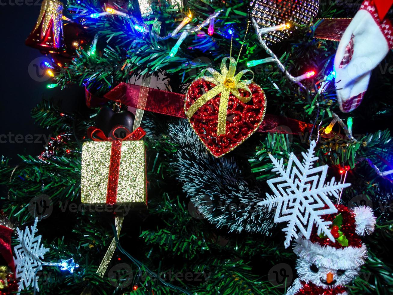 Christmas hanging decorations on fir tree photo