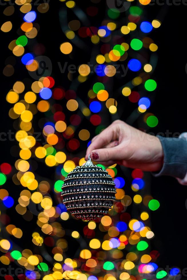 Woman holding Christmas decoration photo