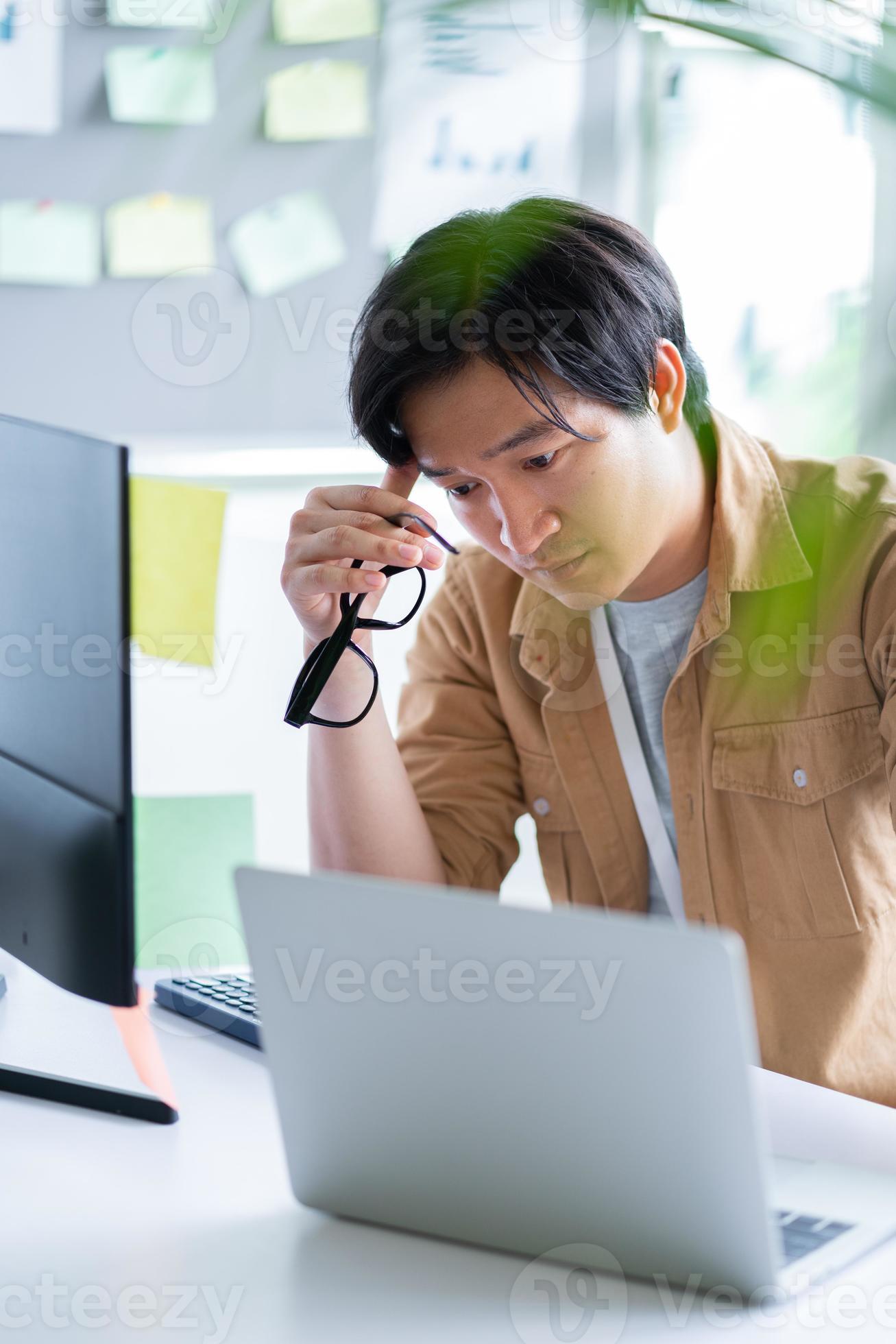 Asian business man working with computer in office photo