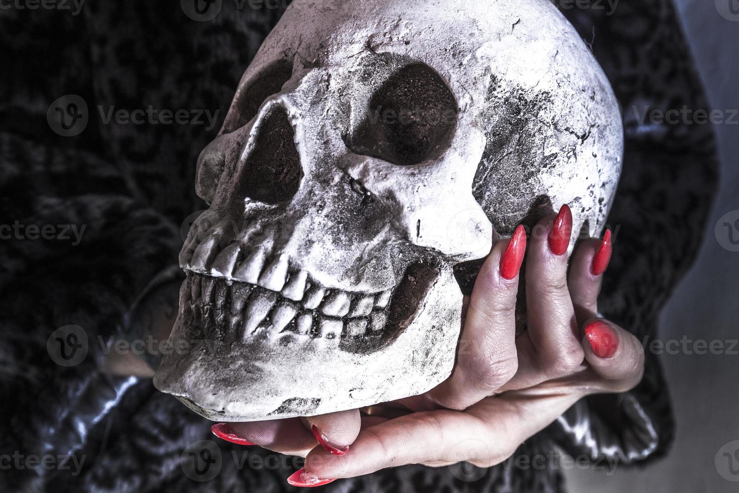 Skull and red nail photo