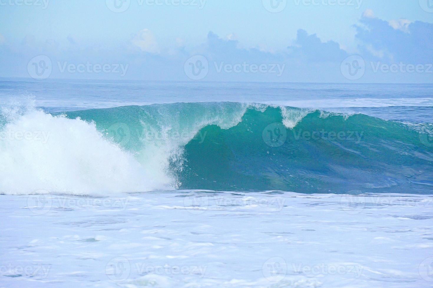 Waves on the blue sea in the coast photo