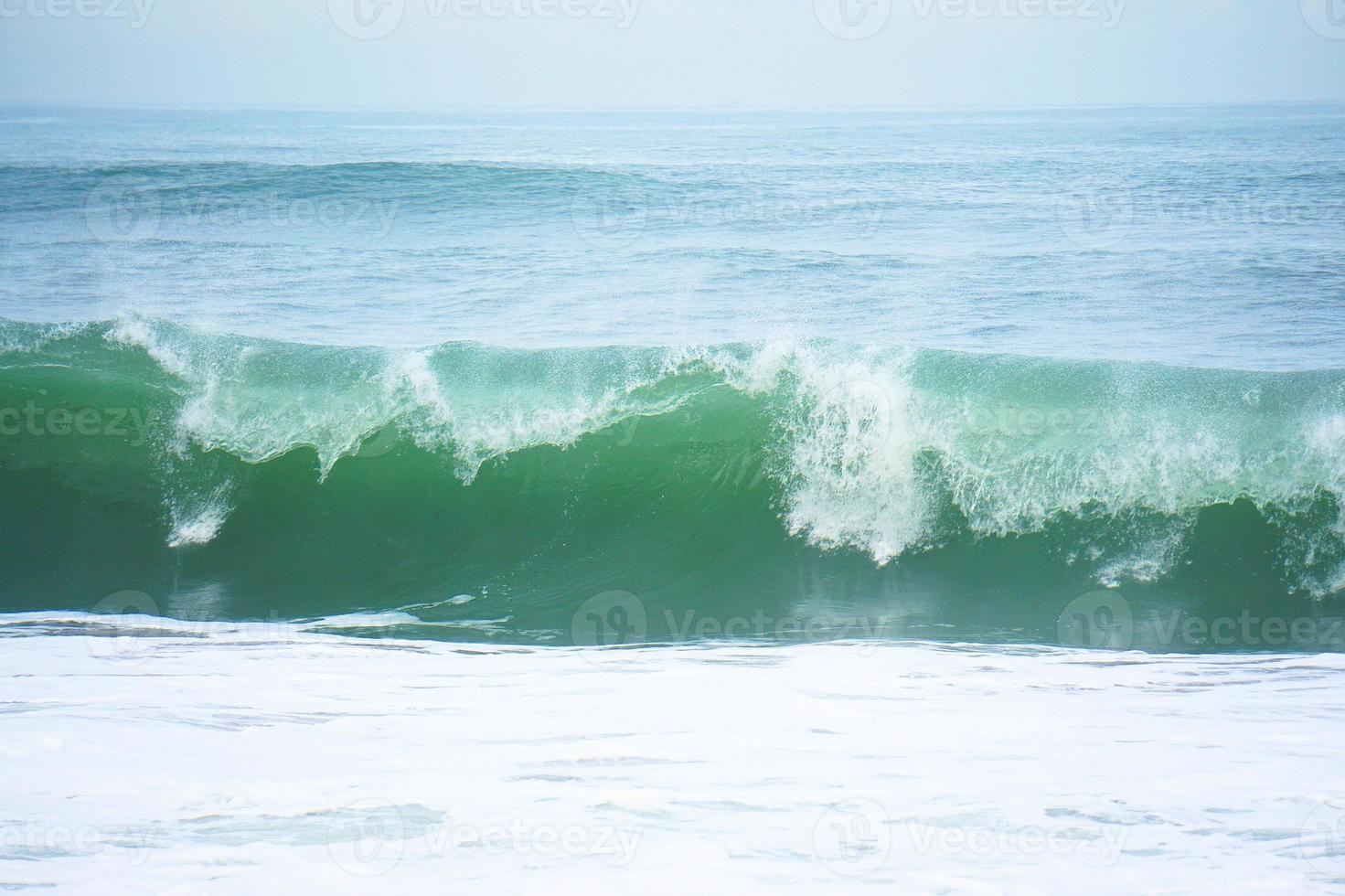 Waves on the blue sea in the coast photo