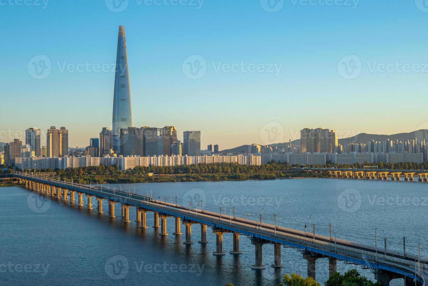 Skyline of Seoul by Han River in South Korea photo