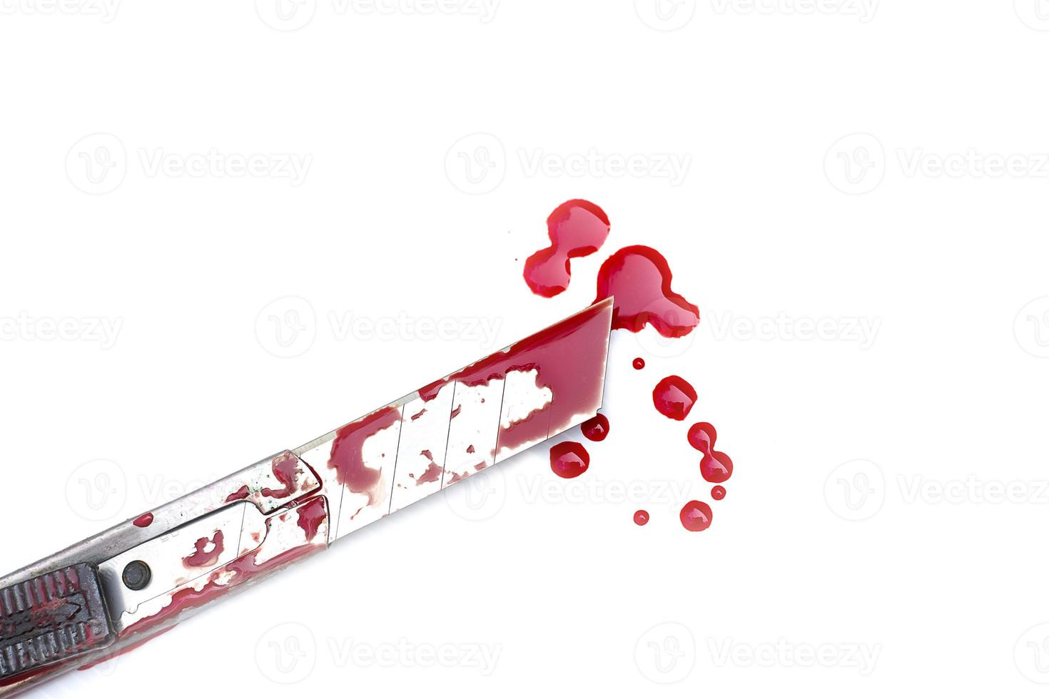 Cutter knife bloody on white background, Social violence Halloween concept photo