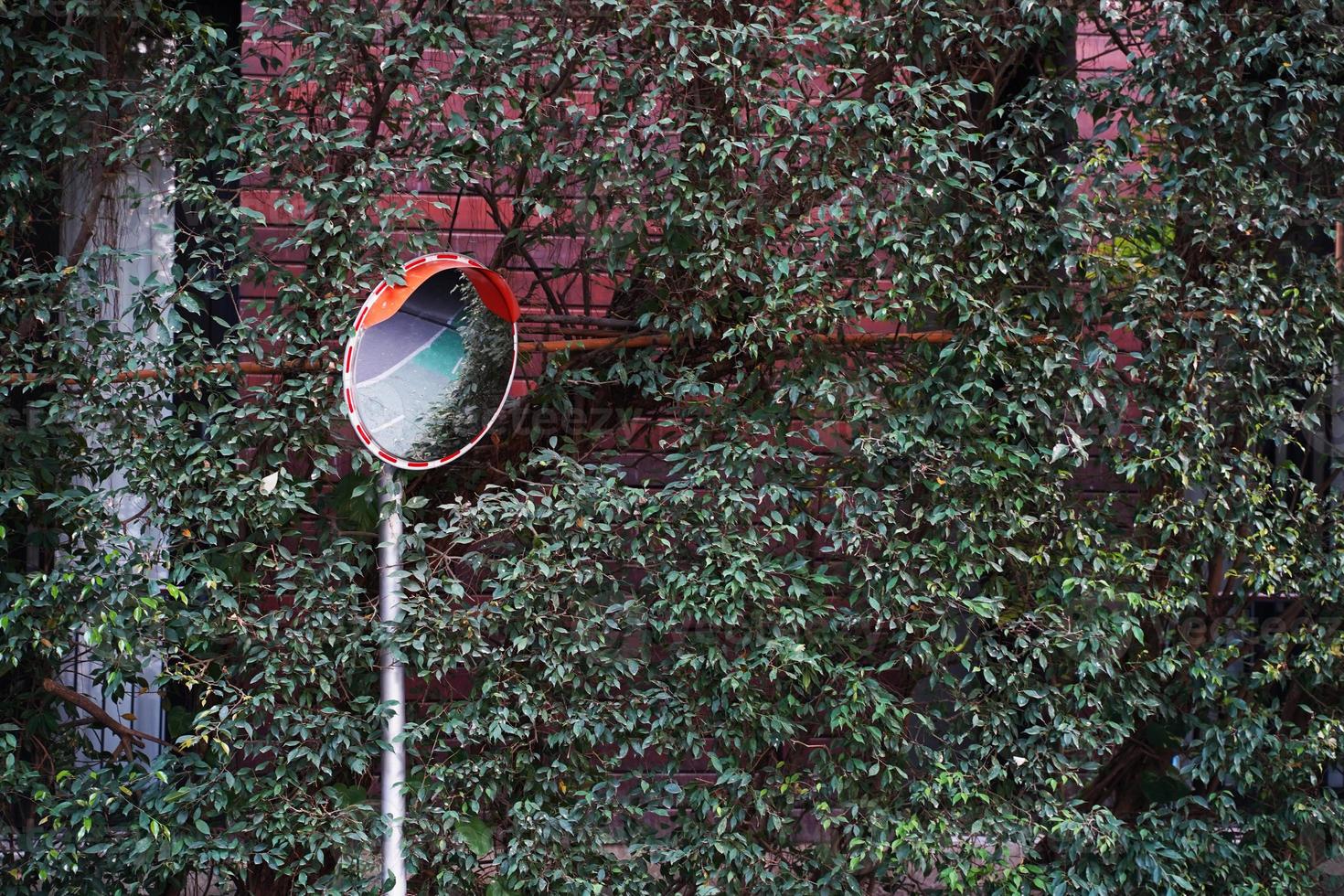 The traffic curve mirror, Curved corner traffic mirror on the roadside. photo