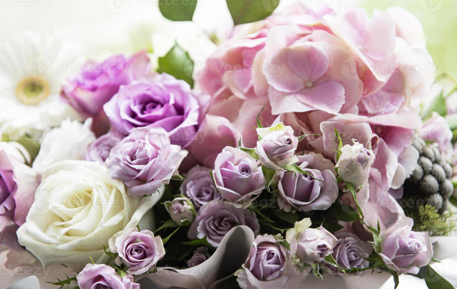 Beautiful flowers in a white round box photo