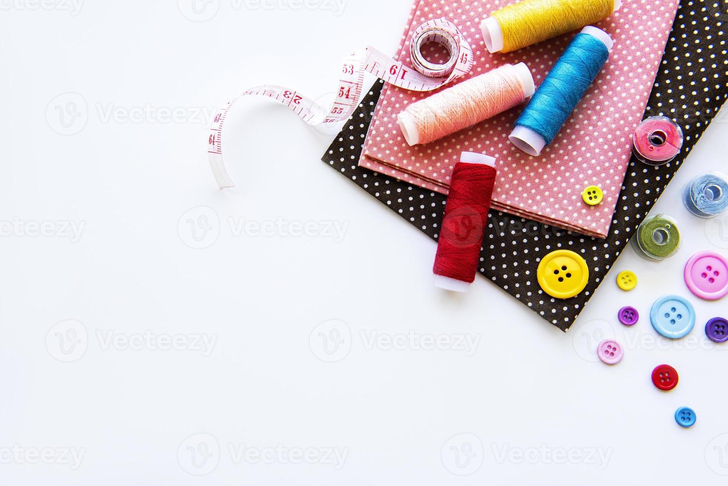 Sewing accessories on a white background photo