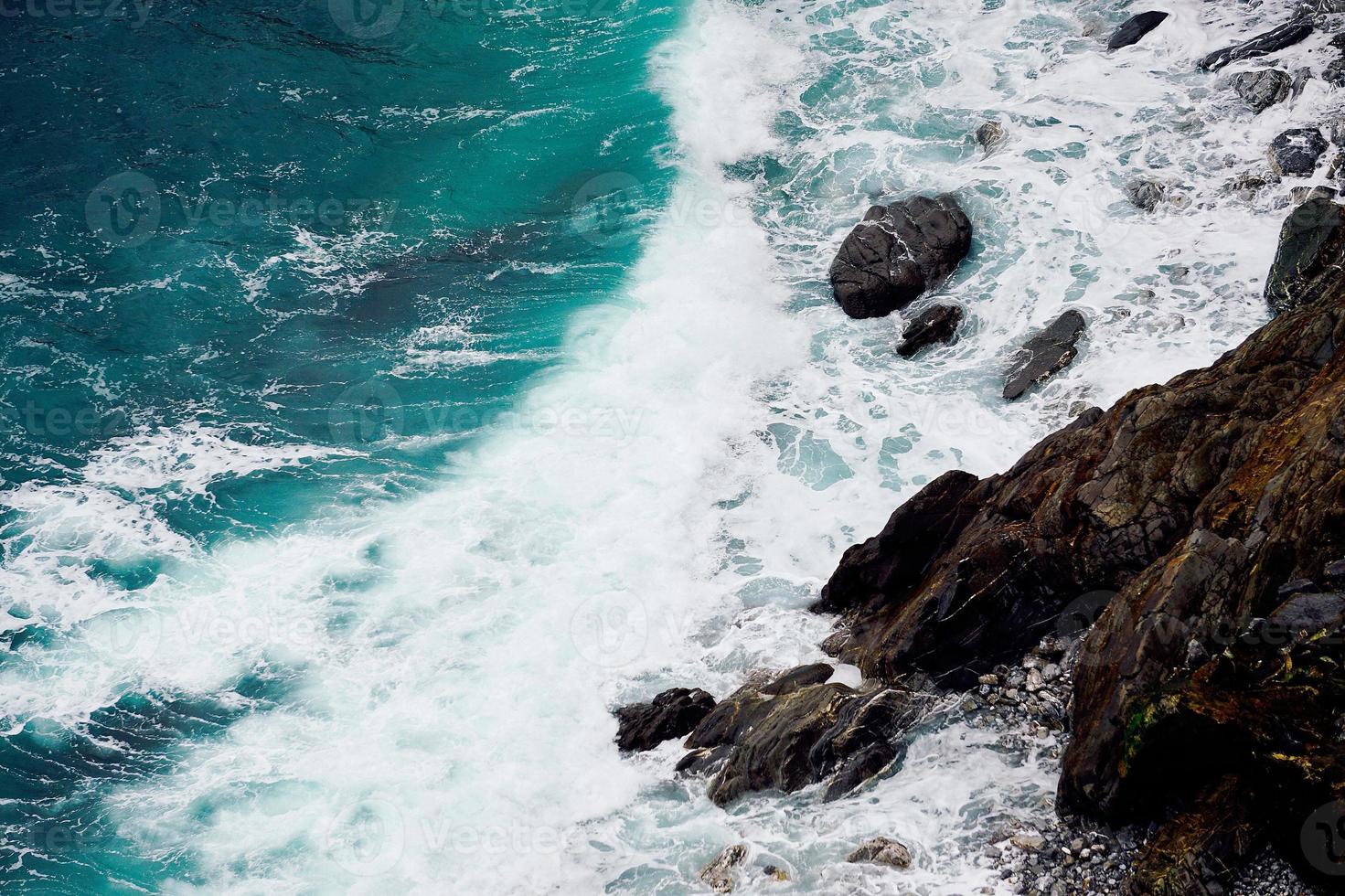 Rocks in the sea in the coast photo