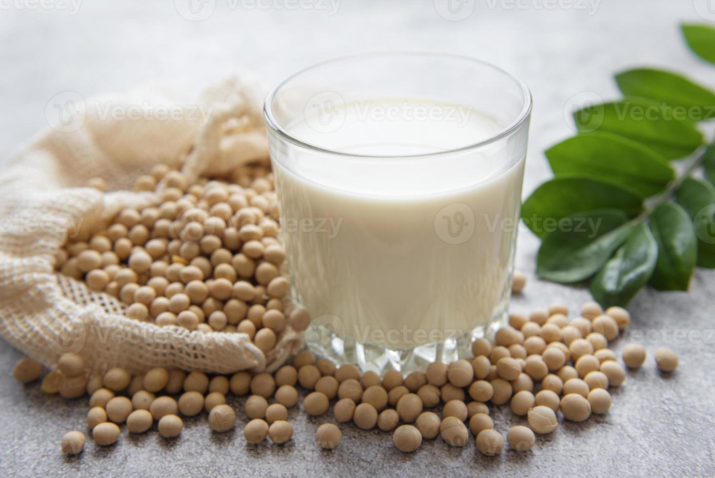 Soy milk and soy on the table photo