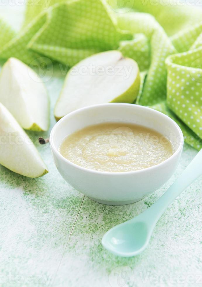 Bowl with fruit baby food and pears photo