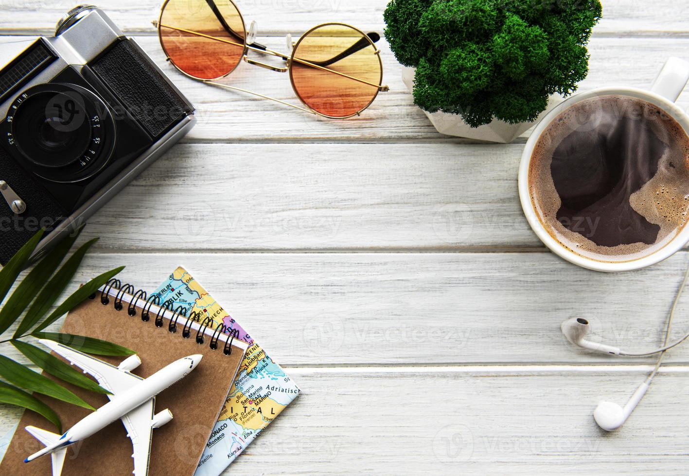 Traveler accessories on wooden  background photo