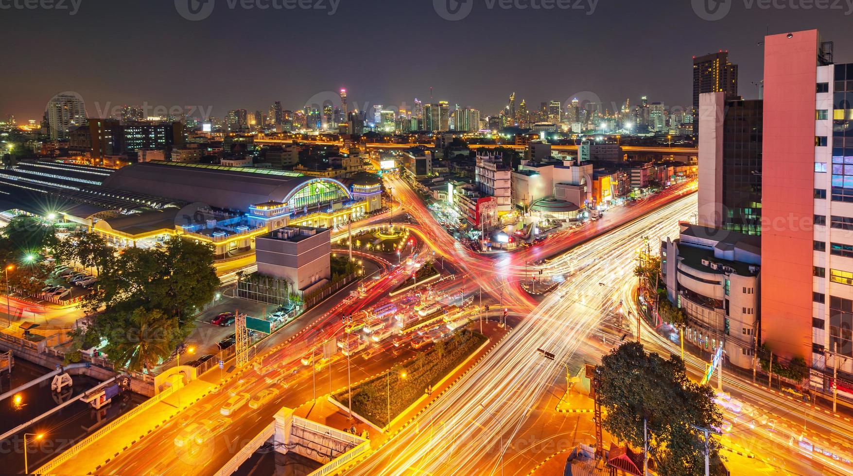 Modern city night background, The light trails on the modern building in Bangkok thailand photo