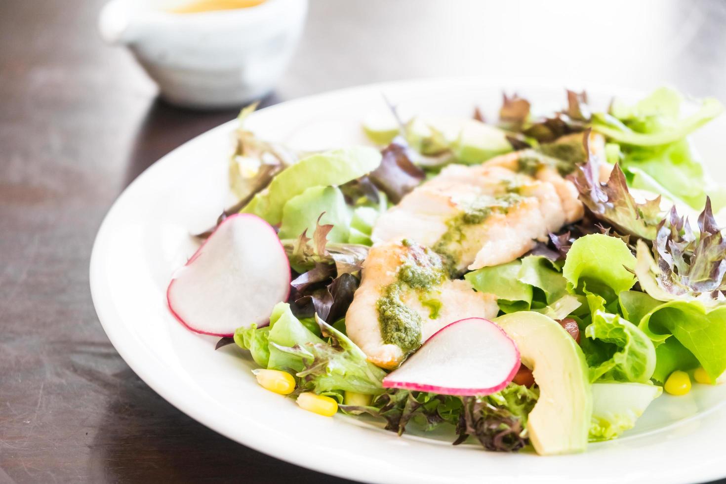 Chicken salad in white plate photo