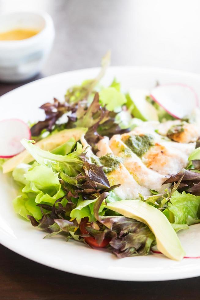 Chicken salad in white plate photo