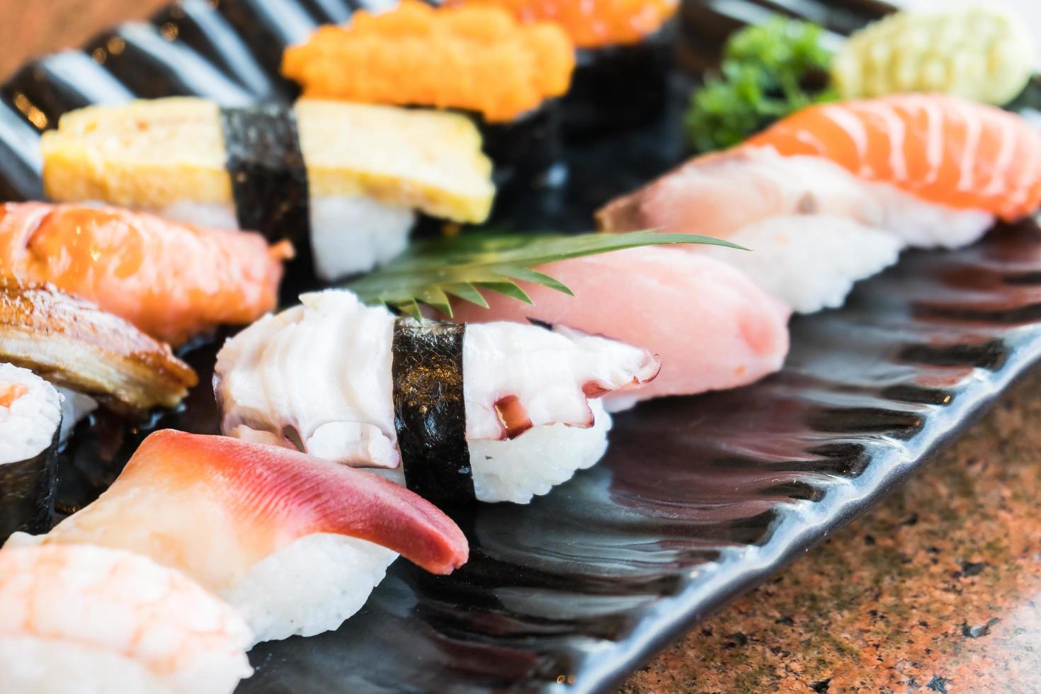 Sushi in black plate photo