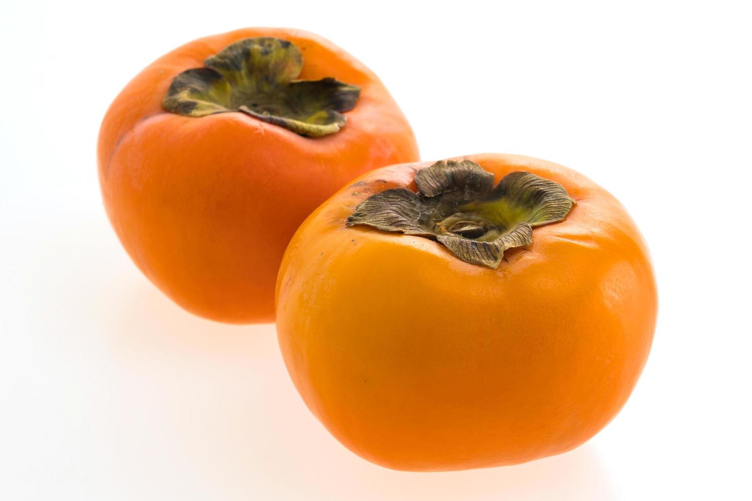 persimmon fruit on white photo