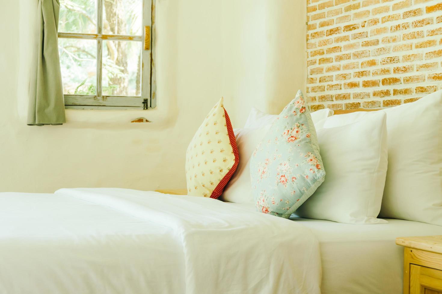 Pillow on bed decoration in bedroom interior photo