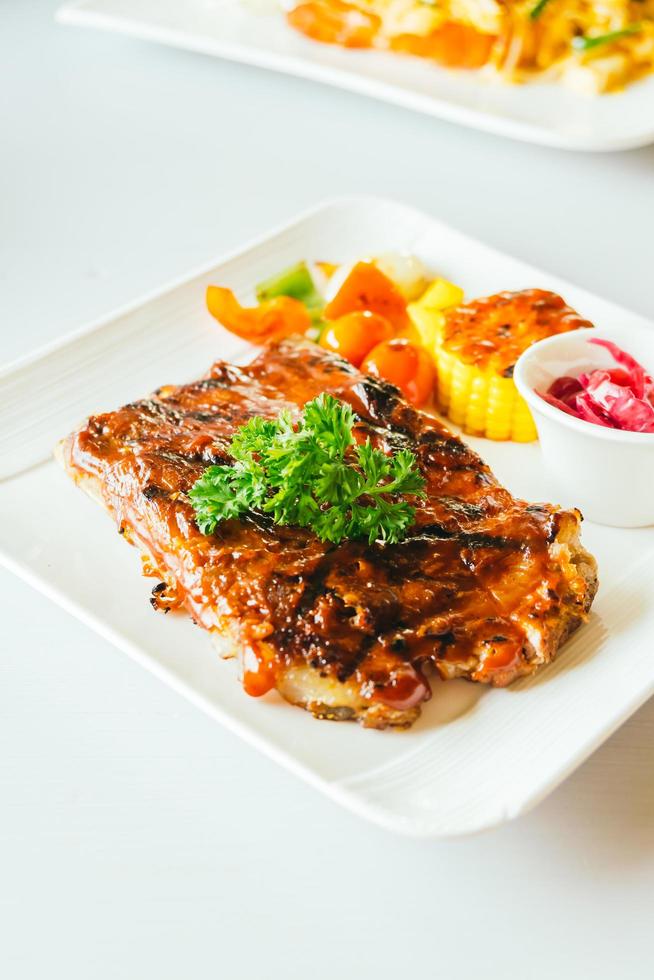 Grilled pork ribs with bbq sauce photo