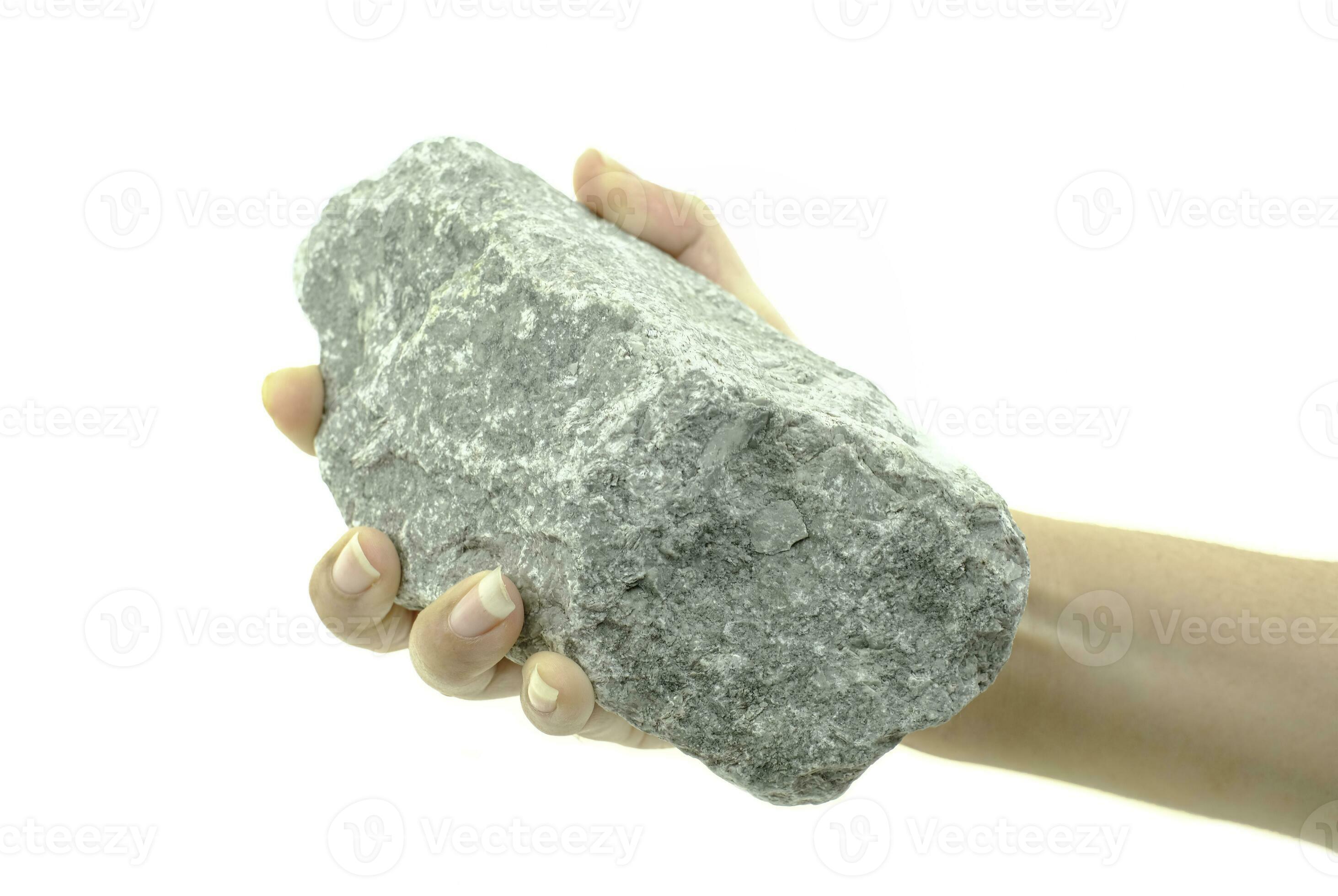 Hand holding stone 2785378 Stock Photo at Vecteezy