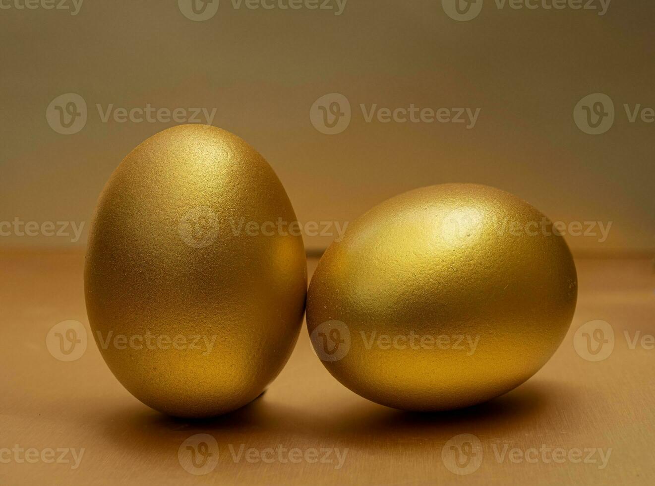 Egg gold on golden background photo