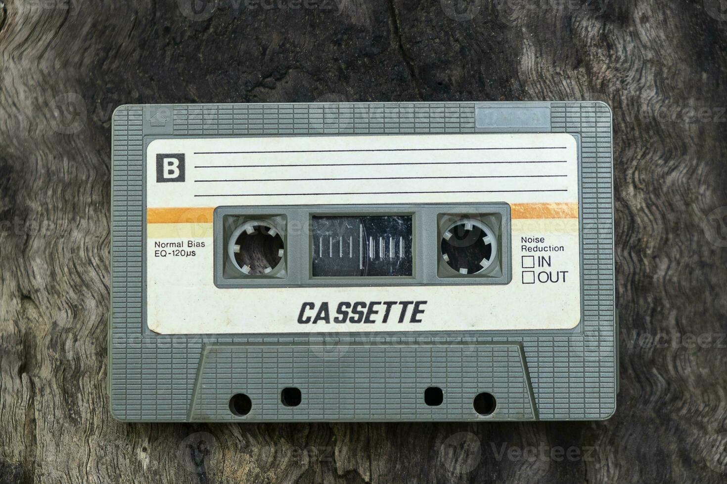 Old fashioned audio tape player on top desk wood photo